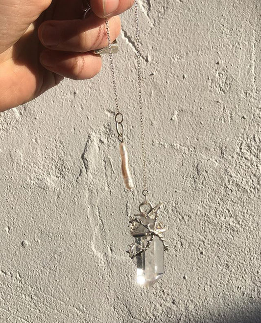 thorns and quartz pendulum